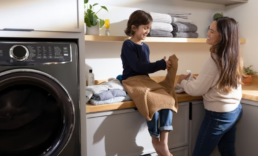 Mother and daughter doing laundry